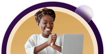 Woman smiling at her laptop.